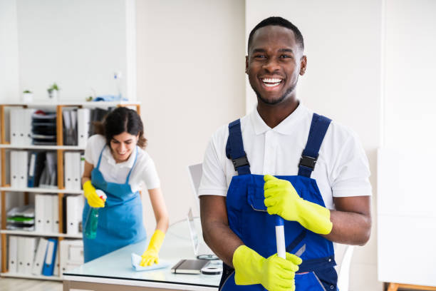 Happy Male Janitor In Office Portrait Of A Happy Male Janitor With Cleaning Equipment In Office caretaker stock pictures, royalty-free photos & images