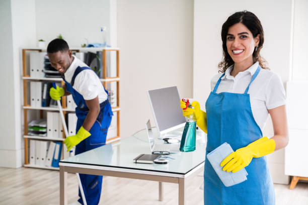 istock Happy Female Janitor In Office 1226515277