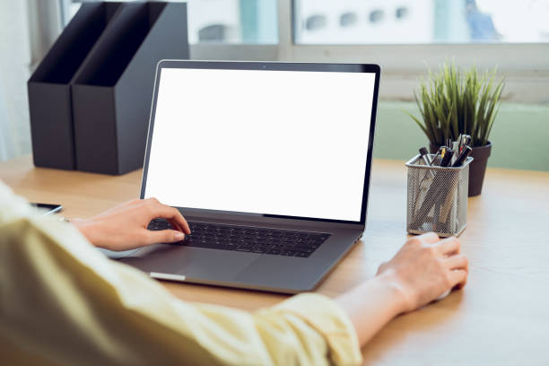 istock Hand using laptop with blank copy space screen for your advertisement. on the table in office. 1226515357