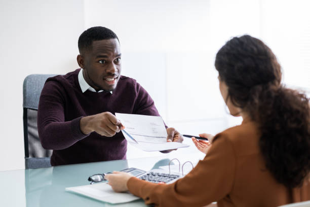 istock Businessman Showing Document To Female Employee 1226515360