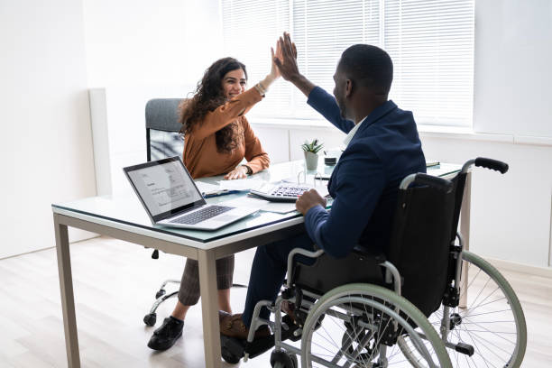 istock Disabled Businessman Giving High Five To His Partner 1226515378