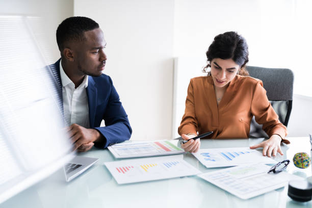 istock Businesswoman Writing On Graph 1226515399