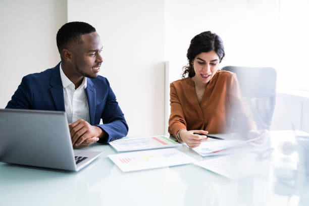 istock Businesswoman Writing On Graph 1226515404