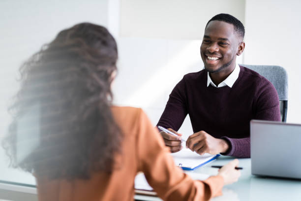 istock Two Businesspeople Talking With Each Other 1226515491