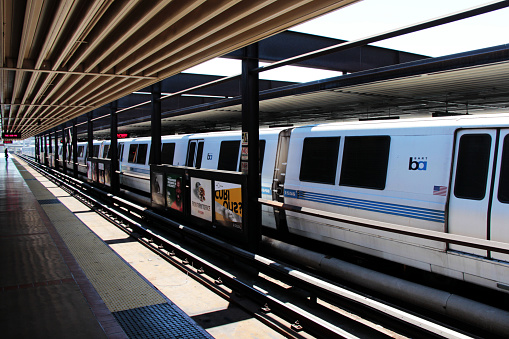 Oakland, CA, USA - August, 14 2014: BART bay area rapid transit train at MacArthur Station.