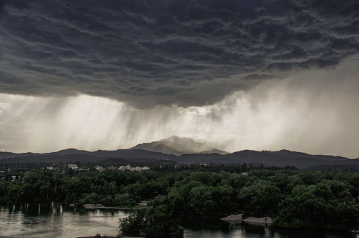 Flooding water out of heavy rain clouds in the Californian region