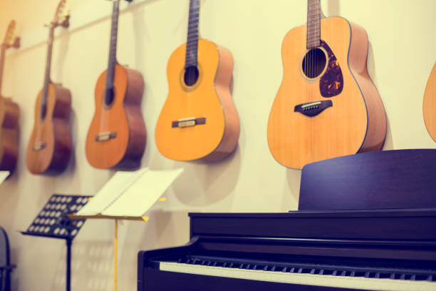 istock Selective focus to classical guitars with piano in music room. 1226525429