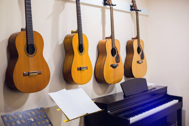 istock Selective focus to classical guitars with piano in music room. 1226525430