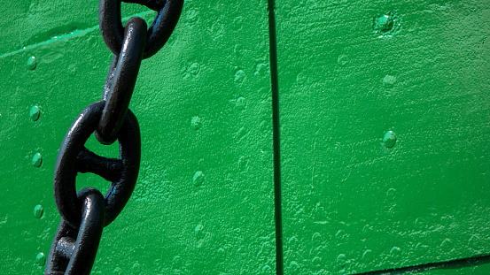 Black chain for anchors on the ship, close-up