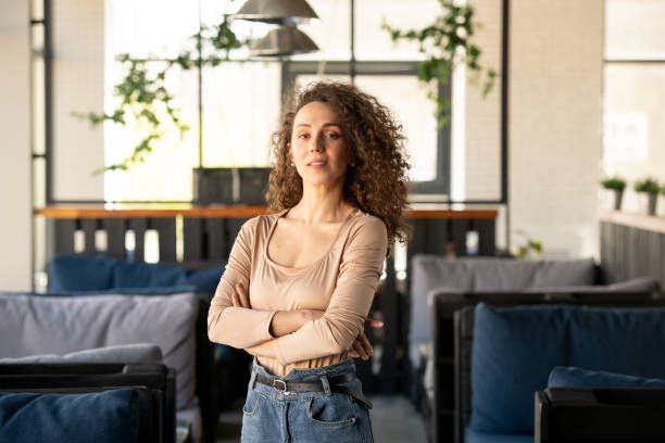 istock Young successful businesswoman standing inside luxurious cafe or restaurant 1226530277