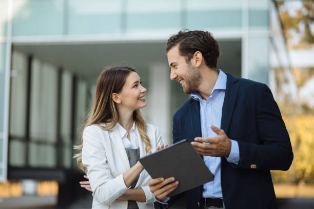 istock Business couple working online outdoors on a tablet computer 1226531071