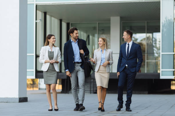 istock Four young executives talking outdoors 1226532573