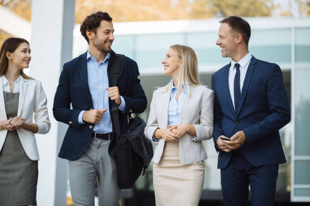 istock Four young executives talking outdoors 1226532636