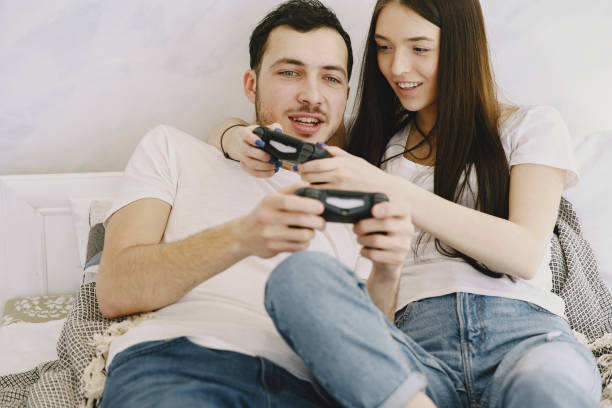 istock Couple at home playing in a video games 1226533579