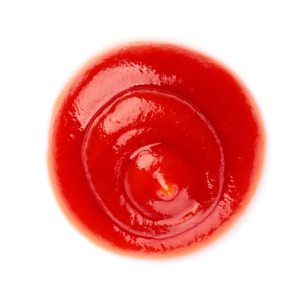 istock Red ketchup tomato sauce closeup isolated on white background 1226536404