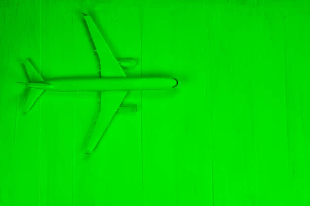 istock Toy plane on green background, top view 1226536720