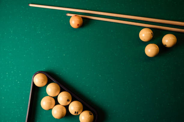 istock Billiard balls and cue on the billiard table, top view, flat lay 1226539794