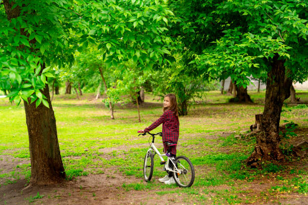 girl with Bicycle in spring Park. sports and camping.