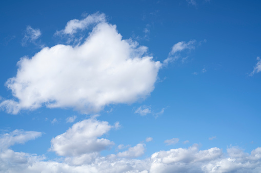 Blue summer sky with white clouds cumulus background