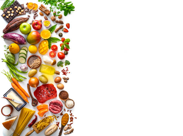 Varied food carbohydrates protein vegetables fruits dairy legumes on white Food and drink large arrangement with carbohydrates protein vegetables and fruits legumes and dairy products on white background leaving side copy space egg food photos stock pictures, royalty-free photos & images