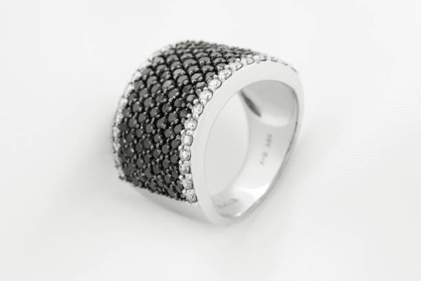 istock White Gold Ring With Black Diamonds On Soft Background 1226544830