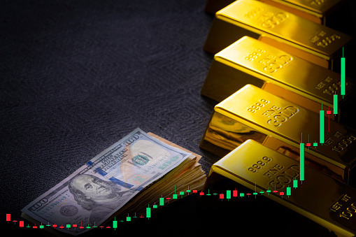 Gold bars and fiat money 100 Dollar note financial concept Doji candlestick bullish earnings positive