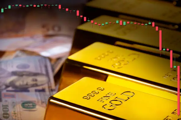 Gold bars and fiat money 100 Dollar note and Euro financial concept Doji candlestick crisis crash downwards bearish
