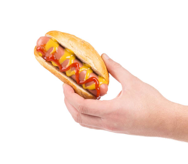 istock The hand holds a hot dog. 1226548622