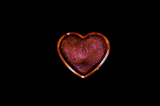 istock Womans lipstick in cream inside a heart. No people 1226549541