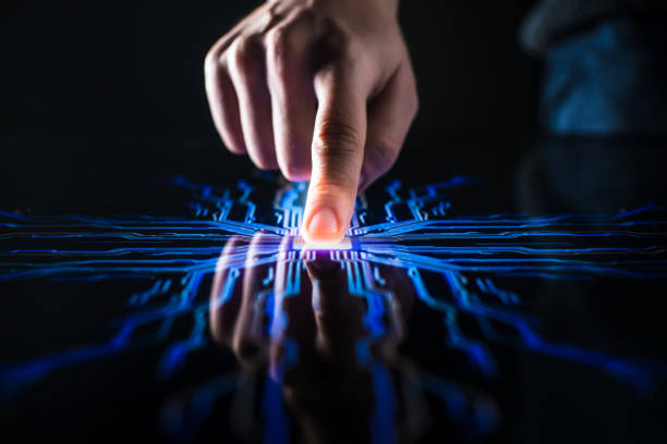 istock Digitalization Concept: Human Finger Pushes Touch Screen Button and Activates Futuristic Artificial Intelligence. Visualization of Machine Learning, AI, Computer Technology Merge with Humanity 1226549695