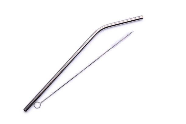 istock Reusable steel straw with brush for cleaning isolated on white background. Zero waste concept, eco friendly product as alternative to plastic straws. Top view 1226551802