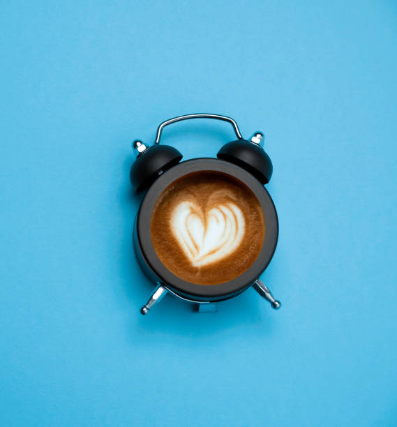 istock coffee with latte art heart  in black alarm clock 1226552421