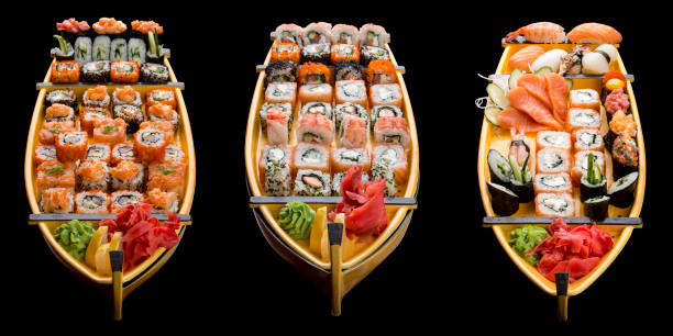 istock Sushi set in a wooden boat on a black background 1226553358