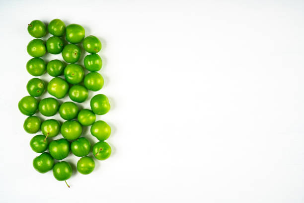 Green sour plum. Greengage on isolated on white background. Top view. Copy space for text message.