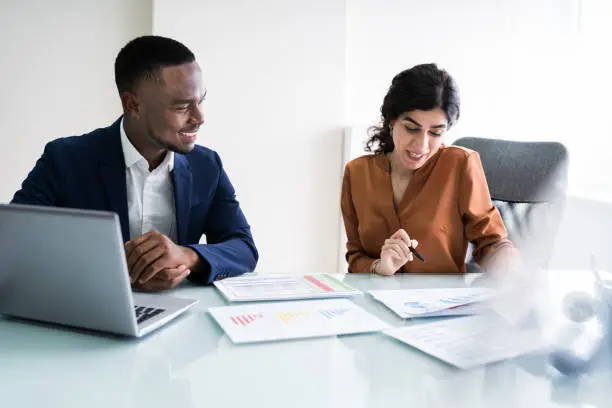 Photo of Businesswoman Writing On Graph