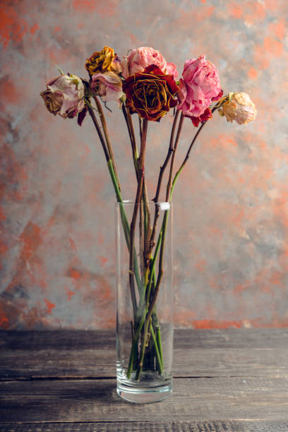istock Dried bouquet with colorful roses on the rustic background 1226557423