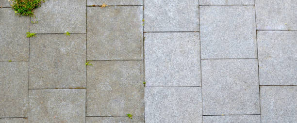 Black granite patio, one half clean, one half dirty