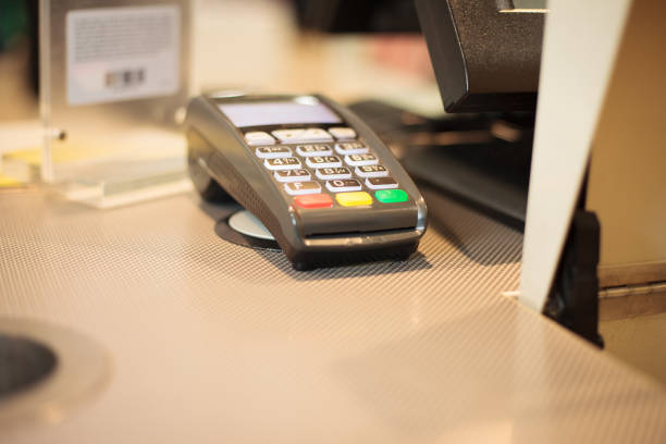 istock Payment terminal on the table at huge shopping center 1226561086