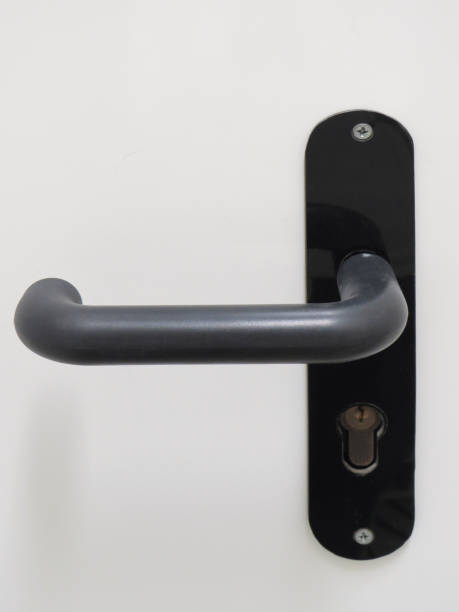 istock Modern black door handle on white background. Architecture detail. Front view. 1226562986