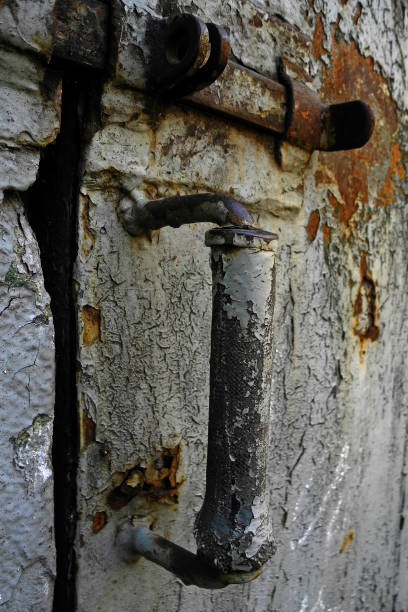 istock Rusty door handle with latch in abandoned house 1226565386
