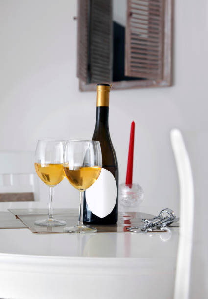 A bottle of wine with two glasses on the table stock photo
