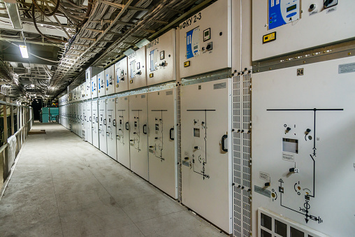 Modern high-voltage substation that feeds a large production, with power lines, switches, disconnectors, control electronics and other units