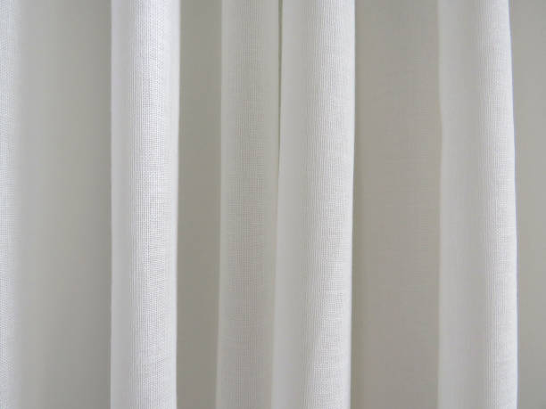 istock White curtain background. Ivory chiffon curtains. White curtain sheet texture. 1226566664