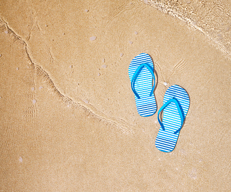 Flip flops on a beach