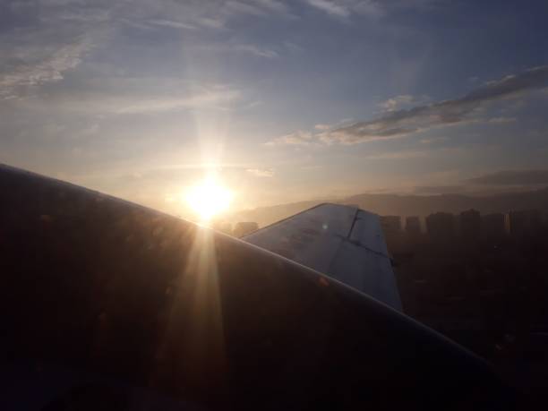istock sunrise over an aeroplane wing flying 1226567697