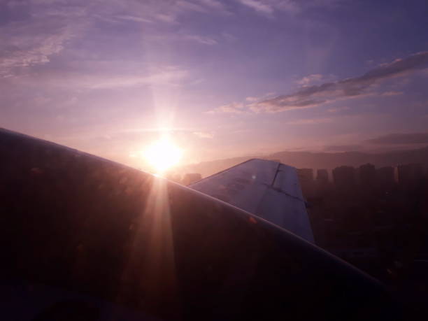 istock sunrise over an aeroplane wing flying 1226567701