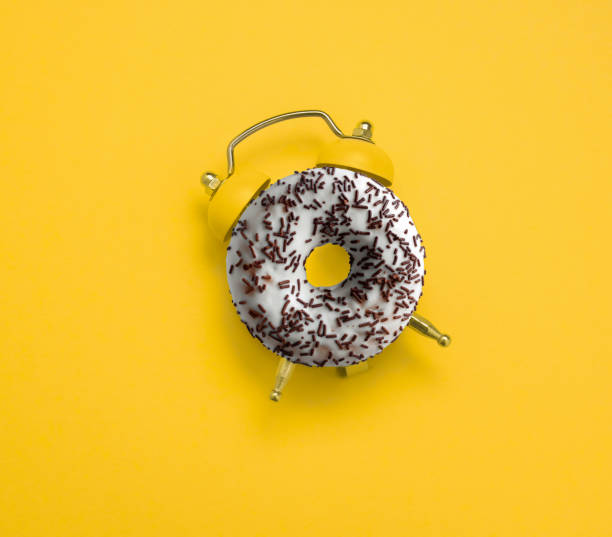 istock top view flat lay creative art collage donut and alarm clock 1226567819
