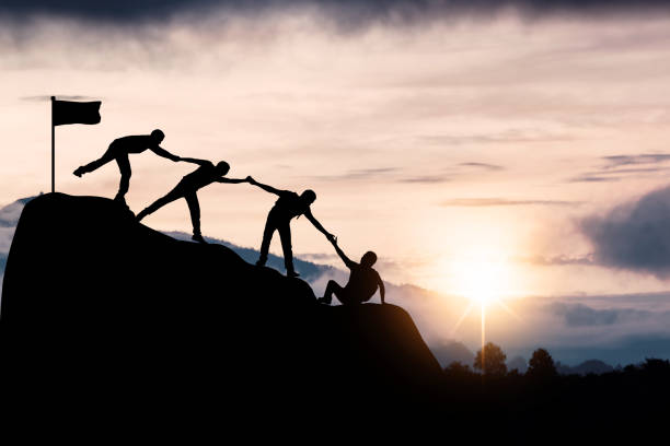 Successful silhouette of teamwork, confident and winner or achievement in business friendship concept, confident and winner in business people team help friend or partner to success stock photo