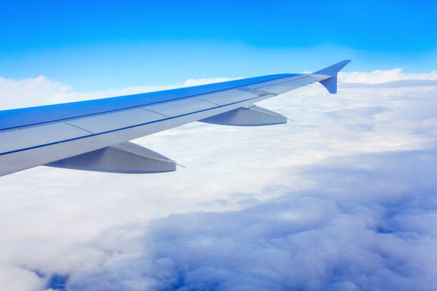 istock airplane wing above the clouds 1226569226