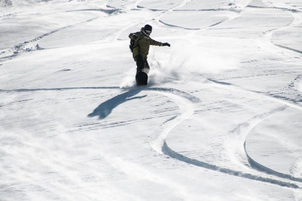 istock Freerider rapidly slides a snow covered steep slope 1226571006